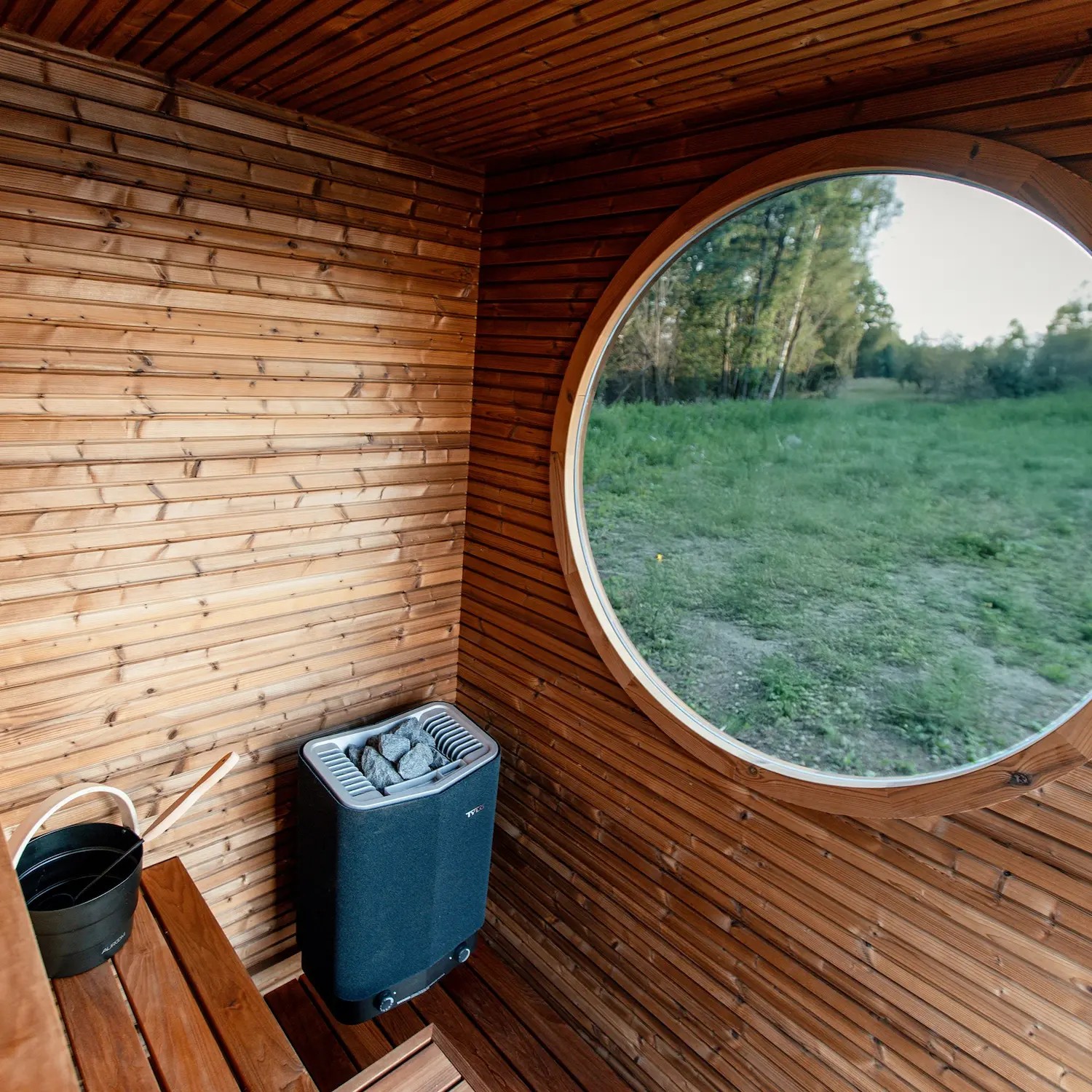 Modern Outdoor Sauna Cabin with Round Window %7C Luxury Wooden Spa with LED Lighting Side profile
