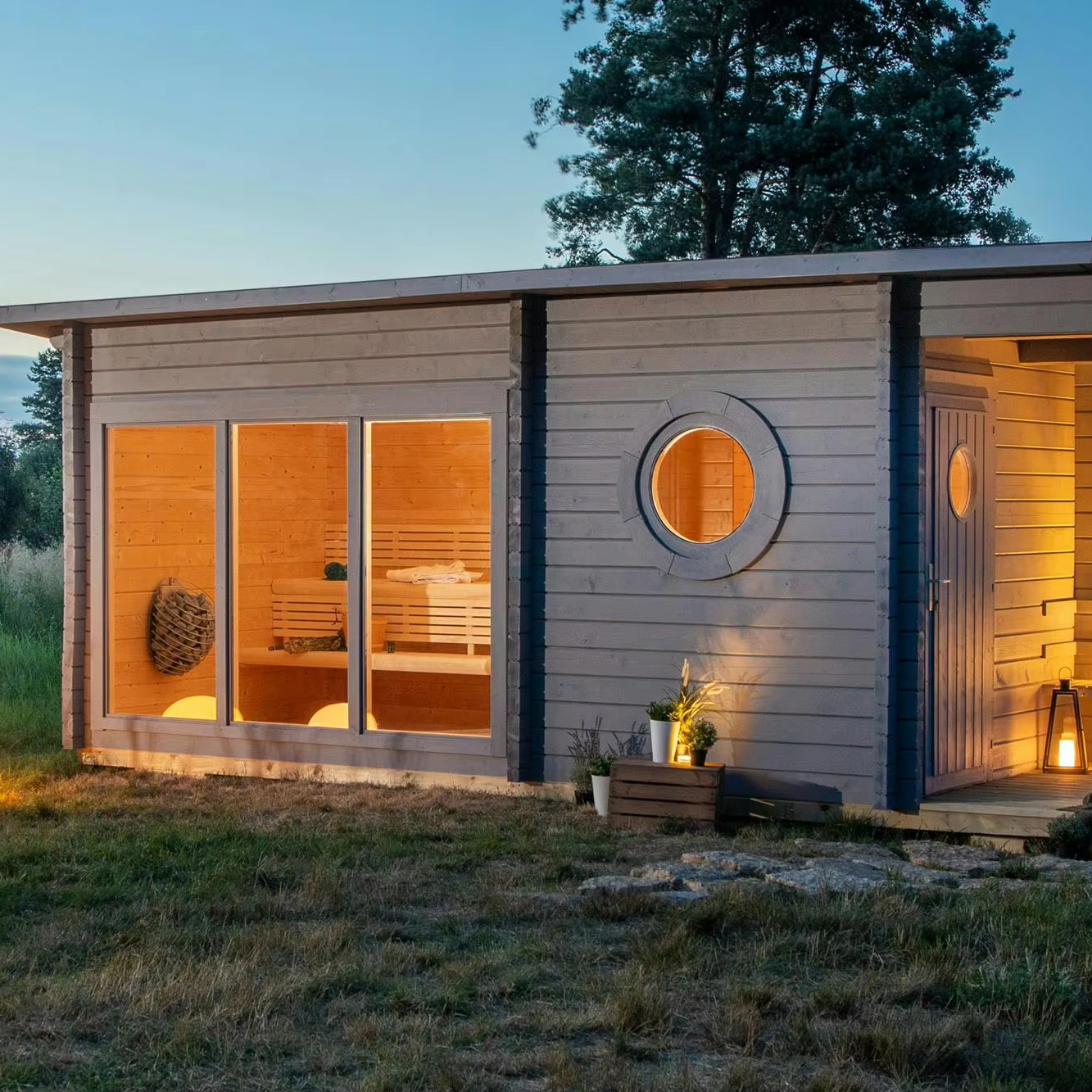 Nordic Grey Cabin Sauna with Patio, Outdoor Sauna with Full Glass Facade and Round Windows Exterior angle