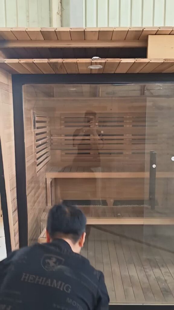 CSauna worker checking sauna interior quality before export