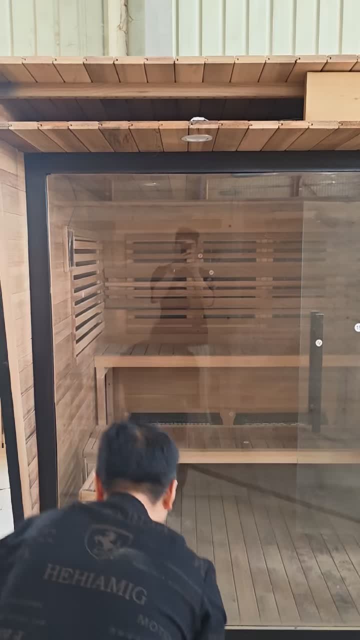 CSauna worker checking sauna interior quality before export