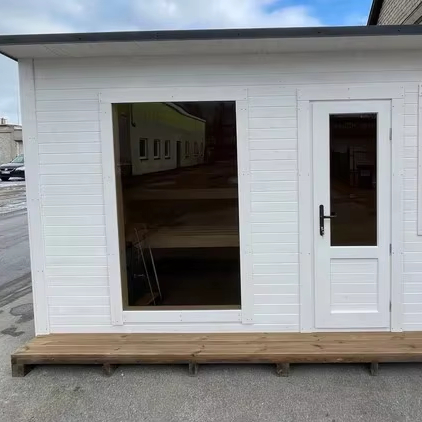 Modern White Cabin-Style Outdoor Sauna with Floor-to-Ceiling Glass Window, 4-6 Person Wood Sauna Room with Side Window Exterior angle