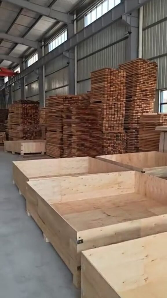 Video frame showing sauna wood material preparation inside CSauna workshop